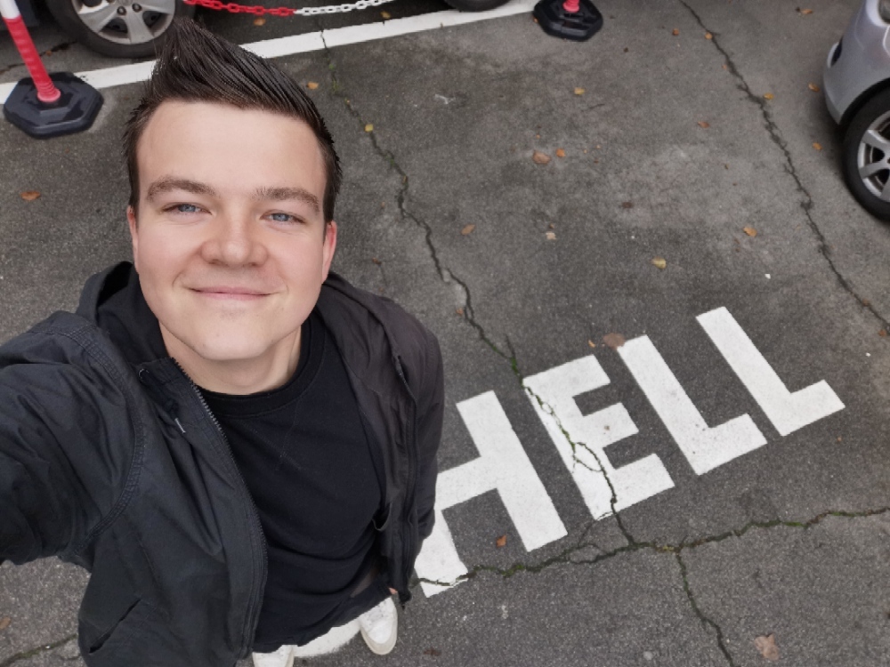 Selfie from above. On the floor next to me HELL written in large letters.